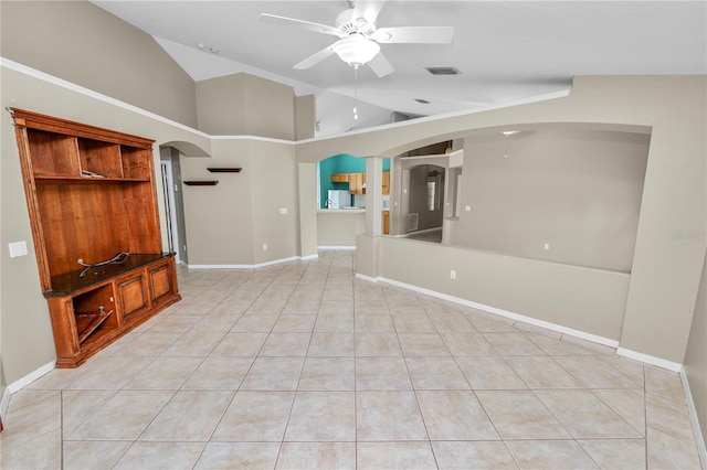 16804 Hawkridge Rd, Lithia, FL 33547 - unfurnished living room with arched walkways, a ceiling fan, lofted ceiling, light tile patterned floors, and baseboards