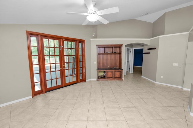 16804 Hawkridge Rd, Lithia, FL 33547 - empty room with a ceiling fan, arched walkways, french doors, baseboards, and high vaulted ceiling