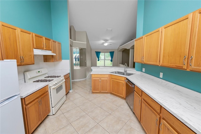 16804 Hawkridge Rd, Lithia, FL 33547 - kitchen with white appliances, a sink, under cabinet range hood, light tile patterned floors, and a peninsula