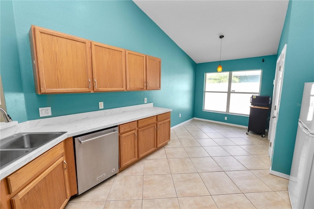 16804 Hawkridge Rd, Lithia, FL 33547 - kitchen with dishwasher, lofted ceiling, freestanding refrigerator, decorative light fixtures, and light tile patterned floors