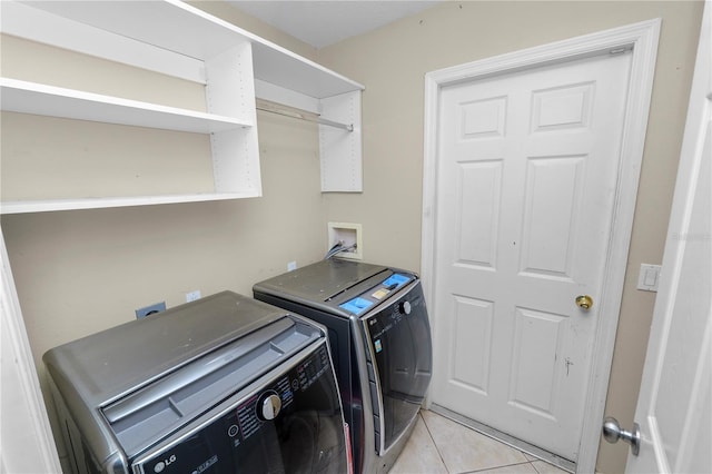 16804 Hawkridge Rd, Lithia, FL 33547 - washroom with independent washer and dryer and light tile patterned floors