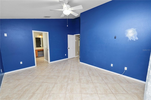 16804 Hawkridge Rd, Lithia, FL 33547 - tiled spare room featuring lofted ceiling, ceiling fan, and baseboards