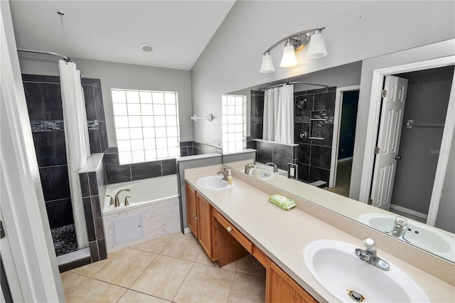 16804 Hawkridge Rd, Lithia, FL 33547 - bathroom with a shower stall, a garden tub, lofted ceiling, double vanity, and tile patterned floors