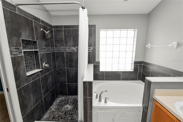 16804 Hawkridge Rd, Lithia, FL 33547 - full bathroom with a garden tub, tiled shower, and vanity