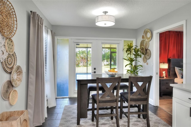 8721 Latham Ln, Hudson, FL 34667 - dining room with a textured ceiling and french doors