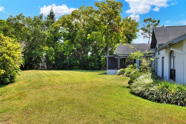 8721 Latham Ln, Hudson, FL 34667 - view of grassy yard featuring a sunroom