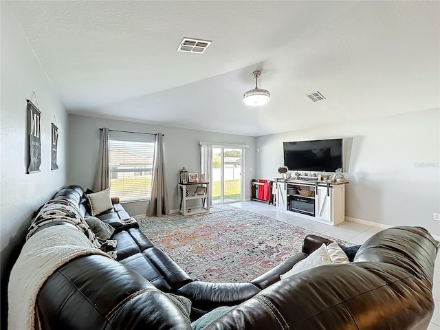 2929 Flying Blackbird Rd, Bartow, FL 33830 - living room featuring vaulted ceiling, baseboards, and light tile patterned floors