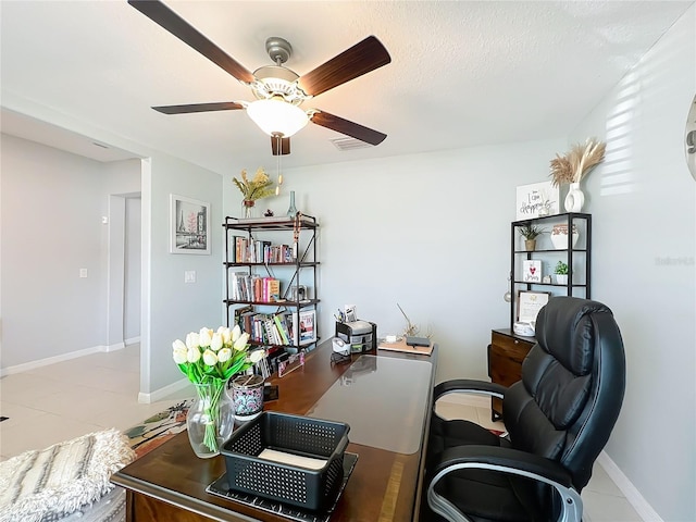 2929 Flying Blackbird Rd, Bartow, FL 33830 - home office featuring a ceiling fan, tile patterned floors, and baseboards
