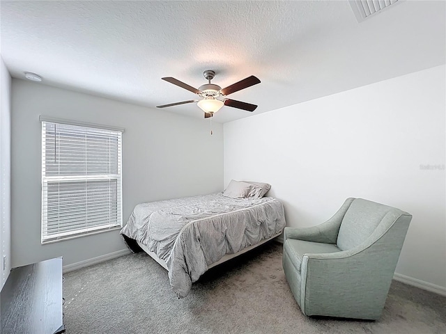 2929 Flying Blackbird Rd, Bartow, FL 33830 - carpeted bedroom with ceiling fan, baseboards, and a textured ceiling