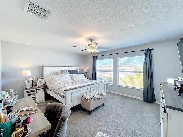 2929 Flying Blackbird Rd, Bartow, FL 33830 - bedroom featuring a textured ceiling, light carpet, ceiling fan, and baseboards