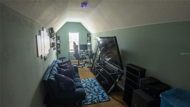 2170 Forest Lake Ave, Dundee, FL 33838 - cinema featuring carpet, a textured ceiling, lofted ceiling, and a textured wall