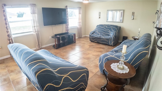 2170 Forest Lake Ave, Dundee, FL 33838 - living area featuring tile patterned flooring and baseboards