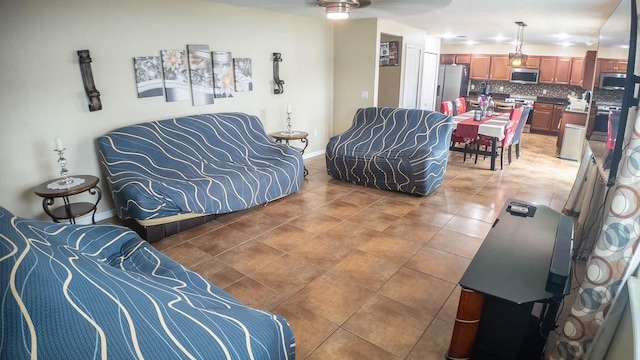 2170 Forest Lake Ave, Dundee, FL 33838 - living area featuring light tile patterned floors and ceiling fan