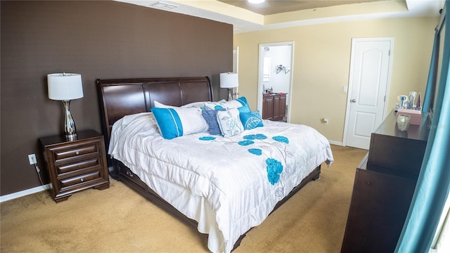 2170 Forest Lake Ave, Dundee, FL 33838 - bedroom with light colored carpet, a raised ceiling, and ensuite bath