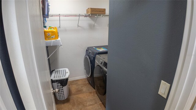 2170 Forest Lake Ave, Dundee, FL 33838 - laundry area featuring separate washer and dryer and tile patterned flooring