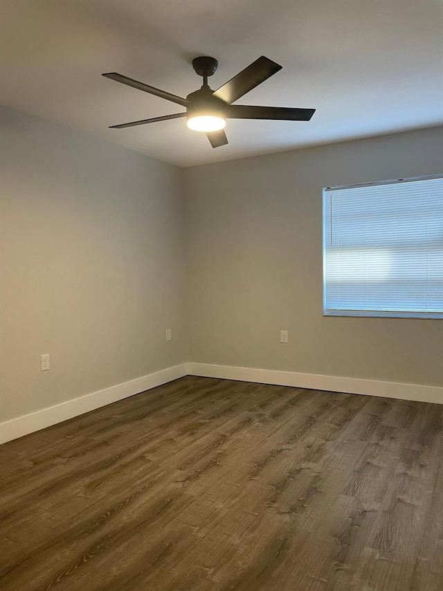 854 Shirley Ann Trl Unit 854/856, Lakeland, FL 33809 - unfurnished room featuring dark wood-style floors, a ceiling fan, and baseboards