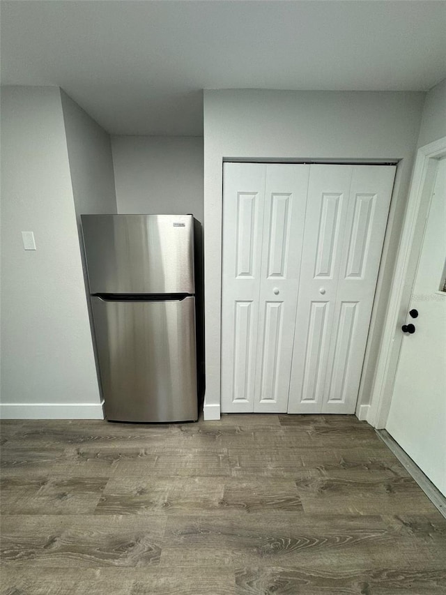 854 Shirley Ann Trl Unit 854/856, Lakeland, FL 33809 - kitchen featuring freestanding refrigerator, wood finished floors, and baseboards
