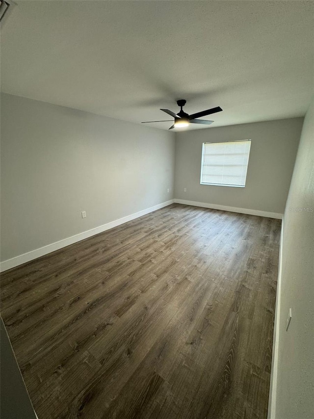 854 Shirley Ann Trl Unit 854/856, Lakeland, FL 33809 - empty room with dark wood-style flooring, ceiling fan, and baseboards