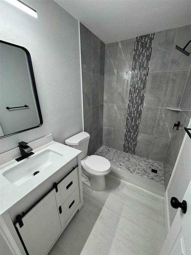 854 Shirley Ann Trl Unit 854/856, Lakeland, FL 33809 - full bathroom with vanity, a stall shower, toilet, and a textured wall