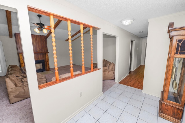 1917 Lori Ln W, Lakeland, FL 33801 - hall featuring carpet flooring, baseboards, tile patterned floors, and a textured ceiling