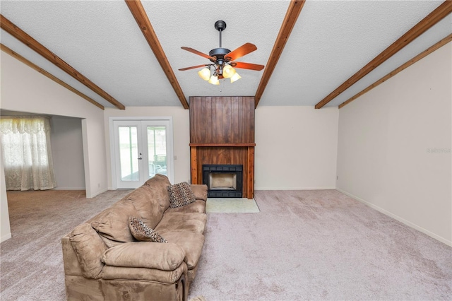 1917 Lori Ln W, Lakeland, FL 33801 - living room featuring light colored carpet, a textured ceiling, a ceiling fan, a large fireplace, and baseboards