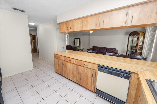 1917 Lori Ln W, Lakeland, FL 33801 - kitchen with dishwasher, butcher block counters, light tile patterned floors, open floor plan, and a textured ceiling