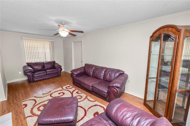 1917 Lori Ln W, Lakeland, FL 33801 - living area with a ceiling fan, wood finished floors, a textured ceiling, and baseboards
