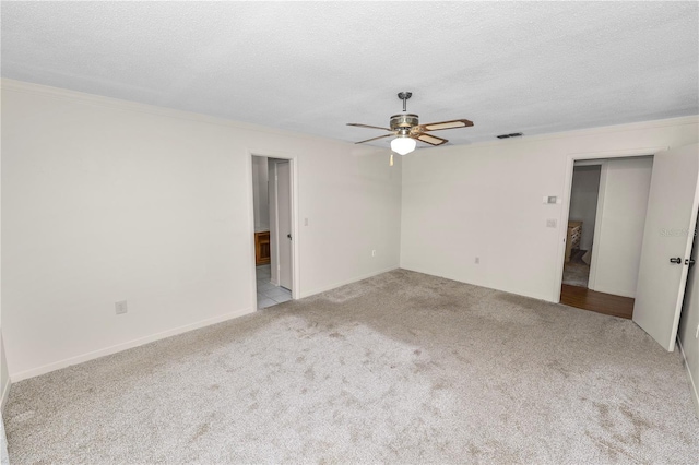 1917 Lori Ln W, Lakeland, FL 33801 - carpeted spare room featuring ceiling fan, a textured ceiling, and ornamental molding