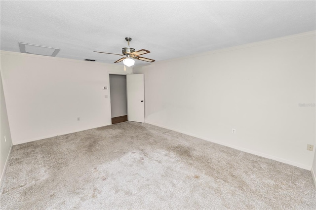 1917 Lori Ln W, Lakeland, FL 33801 - carpeted spare room with attic access, ceiling fan, baseboards, and ornamental molding