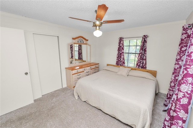 1917 Lori Ln W, Lakeland, FL 33801 - bedroom with carpet, a textured ceiling, a closet, and a ceiling fan