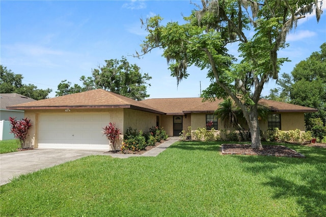 1917 Lori Ln W, Lakeland, FL 33801 - single story home with an attached garage, a front yard, driveway, and stucco siding