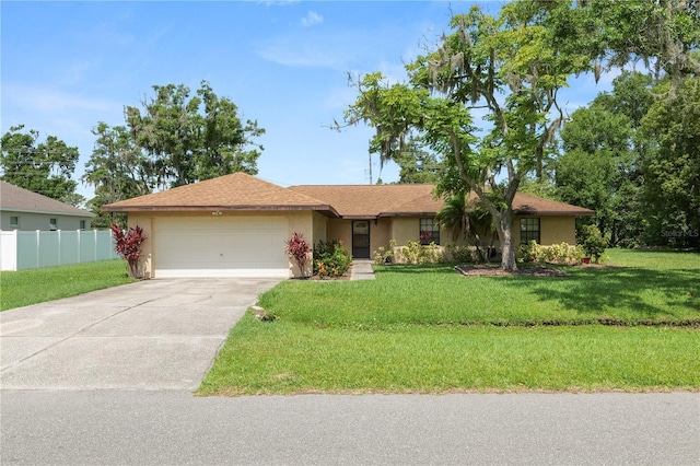 1917 Lori Ln W, Lakeland, FL 33801 - ranch-style home with an attached garage, driveway, and stucco siding
