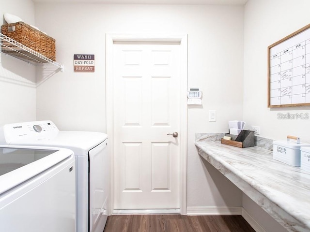 7019 161st Ter E, Parrish, FL 34219 - laundry room featuring separate washer and dryer, dark wood-style flooring, and baseboards