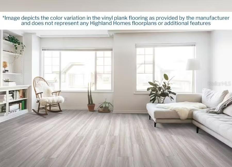 569 Silver Course Radl, Ocala, FL 34472 - living room featuring wood finished floors, baseboards, and plenty of natural light