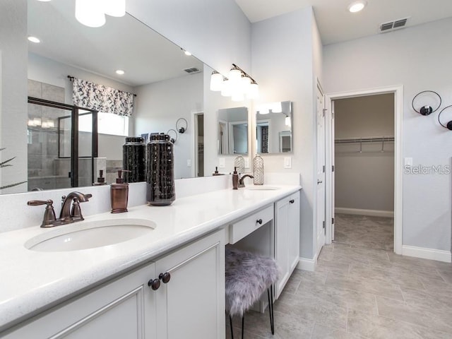 561 Silver Course Run, Ocala, FL 34472 - bathroom with double vanity, a spacious closet, a stall shower, baseboards, and recessed lighting