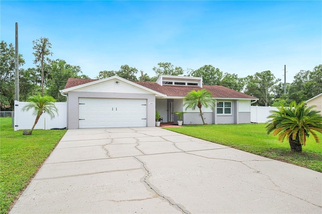 3080 Cross Fox Dr, Mulberry, FL 33860 - mid-century home featuring an attached garage, driveway, and stucco siding