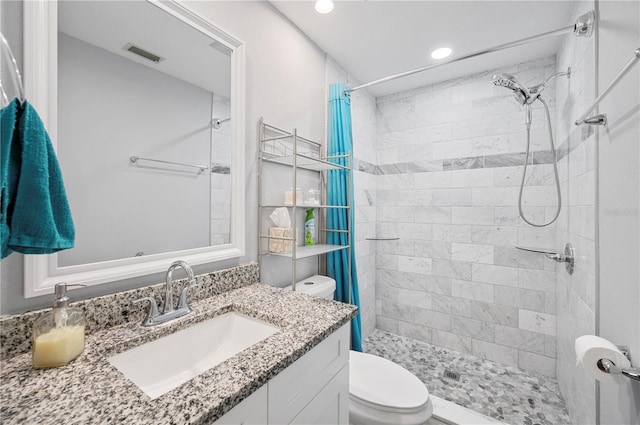 3080 Cross Fox Dr, Mulberry, FL 33860 - full bathroom with toilet, vanity, a tile shower, and recessed lighting