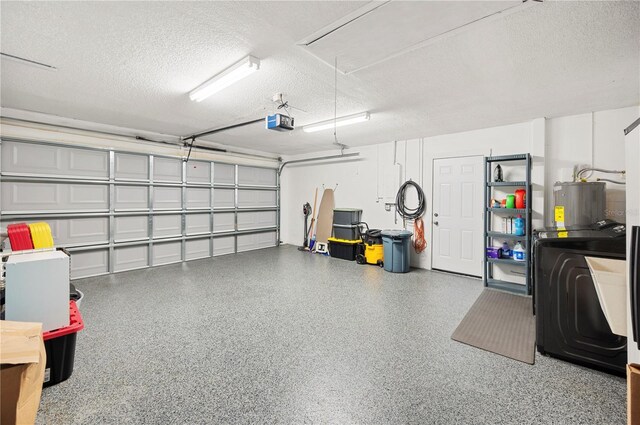 3080 Cross Fox Dr, Mulberry, FL 33860 - garage featuring a garage door opener and water heater