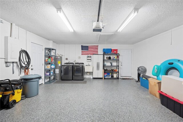 3080 Cross Fox Dr, Mulberry, FL 33860 - garage with washer and dryer, electric panel, electric water heater, a sink, and a garage door opener