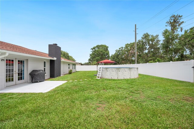 3080 Cross Fox Dr, Mulberry, FL 33860 - view of yard featuring french doors and a patio