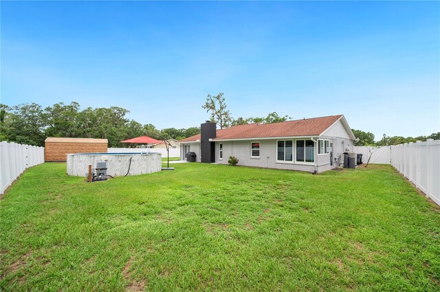 3080 Cross Fox Dr, Mulberry, FL 33860 - rear view of property featuring a chimney