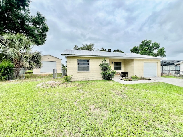 355 Pico Ct, Lakeland, FL 33809 - view of front of house with brick siding, an attached garage, concrete driveway, and metal roof
