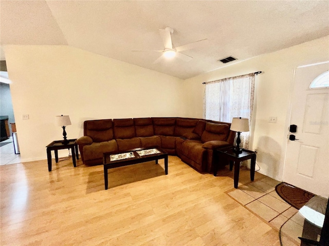355 Pico Ct, Lakeland, FL 33809 - living room featuring a ceiling fan, vaulted ceiling, and light wood-type flooring