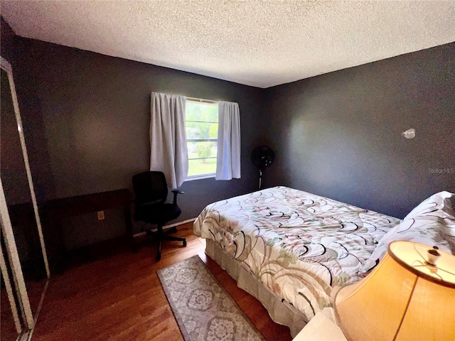 355 Pico Ct, Lakeland, FL 33809 - bedroom featuring wood finished floors and a textured ceiling