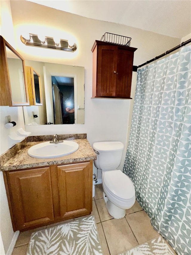 355 Pico Ct, Lakeland, FL 33809 - bathroom with vanity, tile patterned floors, toilet, and baseboards