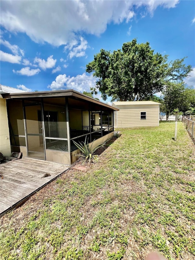 355 Pico Ct, Lakeland, FL 33809 - view of yard featuring a sunroom and a deck