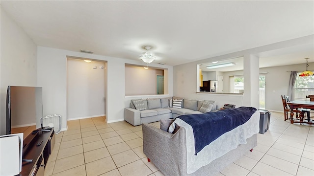 7337 Hunters Greene Cir, Lakeland, FL 33810 - living area with light tile patterned floors and baseboards
