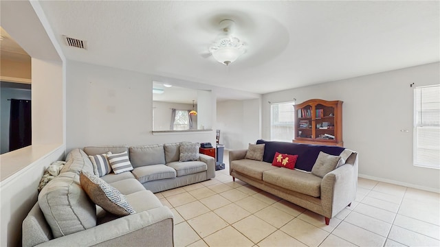 7337 Hunters Greene Cir, Lakeland, FL 33810 - living area featuring light tile patterned flooring and baseboards