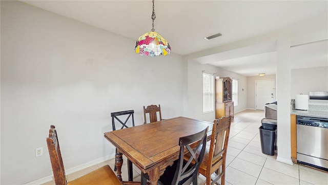 7337 Hunters Greene Cir, Lakeland, FL 33810 - dining space featuring light tile patterned floors and baseboards