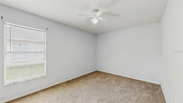 7337 Hunters Greene Cir, Lakeland, FL 33810 - empty room featuring carpet flooring, ceiling fan, plenty of natural light, and baseboards